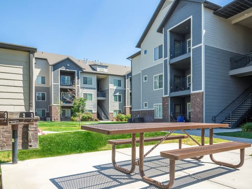 Courtyard With Bbq Area And Lush Gardens at Four Seasons at Southtowne Apartments, Utah, 84095