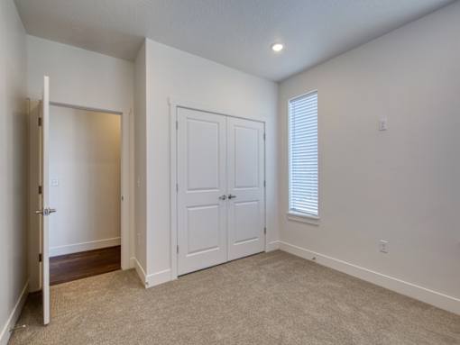 Bedroom with Double Door Closet at Orchard Park Apartments