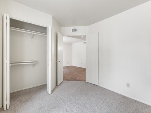 Bedroom with Double Doors at Rio Seco Apartments