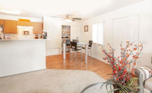 Living Room With Kitchen View at Aspen Park Apartments, Sacramento, CA