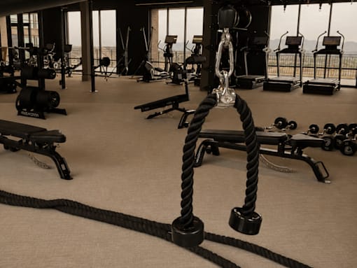 A gym with a rope and weights.
