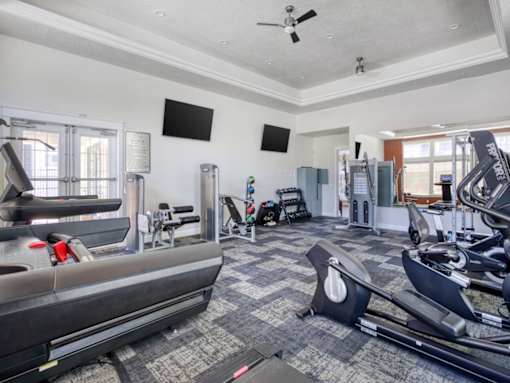 A spacious gym with a variety of exercise equipment at the Talavera at the Junction.