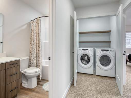 Full Washer and Dryer with Shelves at The Amber 2