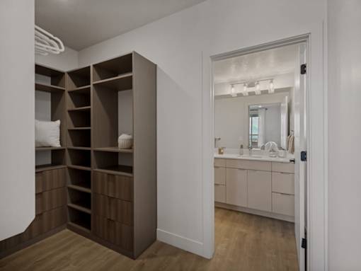 A bathroom with a vanity and a large mirror.