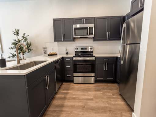 Kitchen with Dark Features at The Arza Apartments