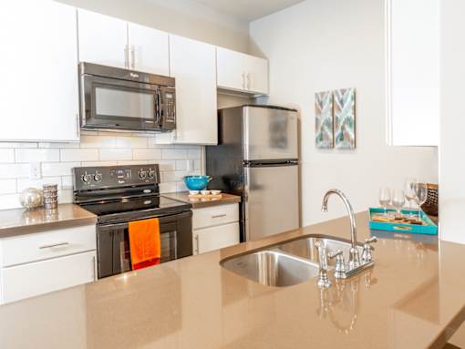 Kitchen with Silver Appliances at San Tropez