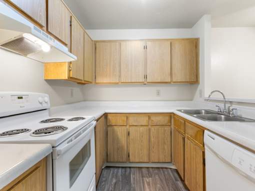 Kitchen with White Appliances at Rio Seco Apartments