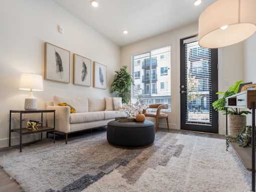 Living Room with Patio at The Arza Apartments