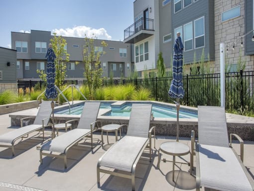 Lounge Chairs Facing Pool at The Austin Townhomes