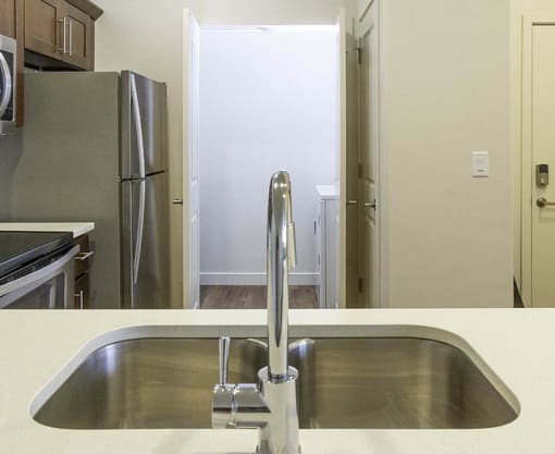 Fully Equipped Kitchen and Laundry Room at Four Seasons Apartments & Townhomes, North Logan