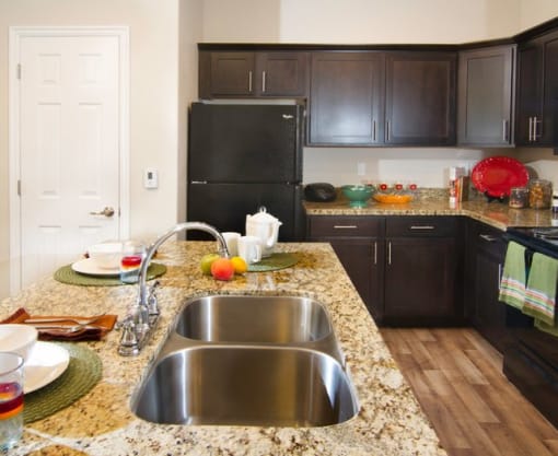 Modern Kitchen with Granite Countertops and Upgraded Black Appliances r at Talavera at the Junction Apartments & Townhomes, Utah, 84047