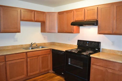 Electric Range In Kitchen at Village Grove Apartments, Escondido, CA, 92025