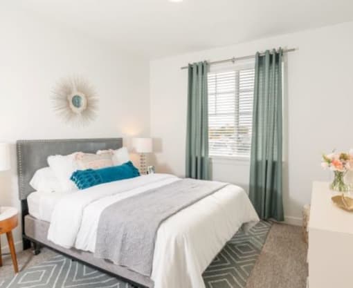 Full-size Guest Bedroom with Large Window at Parc on 5th Apartments