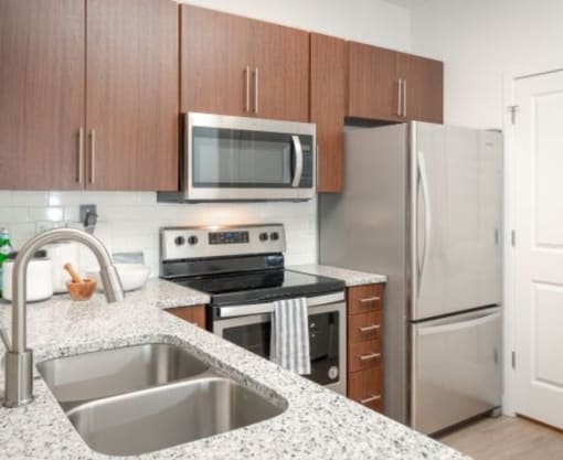 Gourmet Kitchen with Granite Countertops & Stainless Steel Appliances
