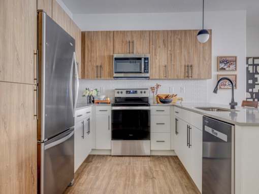 The Foundry Kitchen with Silver Appliances at The Foundry Apartments & Townhomes, Billings, Utah