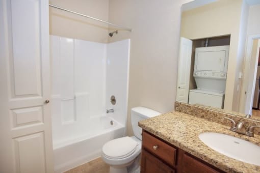Bathroom with Granite Countertops at Revo 225 Apartments, Renton, WA, 98057