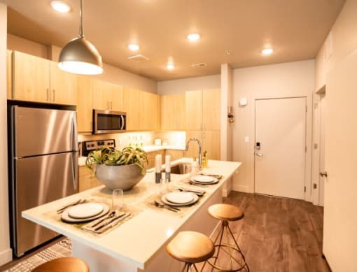 Kitchen With Island Dining at Soleil Lofts Apartments, Herriman, UT