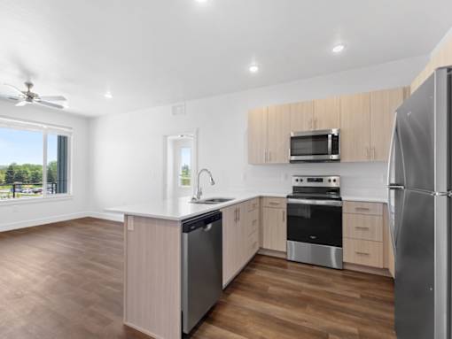 The Grove at Orchard Park Kitchen by Living Room
