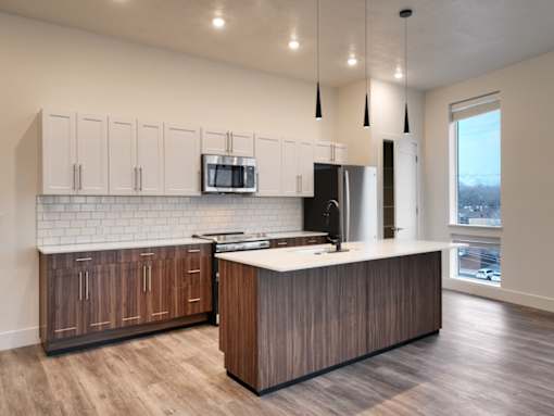 The Stack - Sugarhouse Apartments Kitchen with White and Brown Cabinets