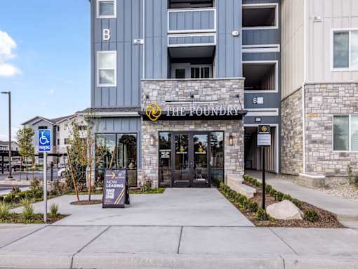 The entrance to a building with a sign that reads "1111 Foundry".