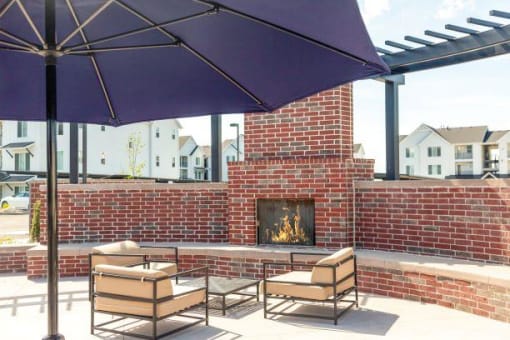 Outdoor courtyard with fire pit at Rivulet Apartments, American Fork, UT