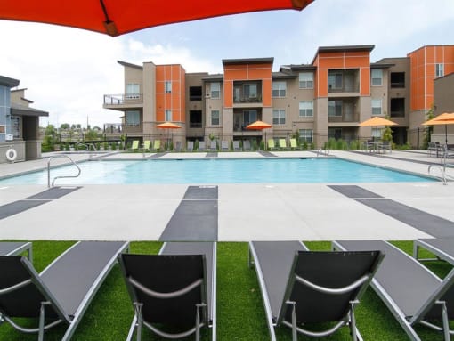 Swimming Pool With Lounge Chairs at Lofts at 7800 Apartments, Midvale, UT, 84047