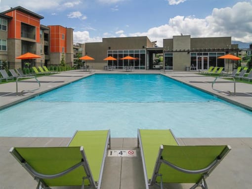 Umbrella Shaded Chairs By Pool at Lofts at 7800 Apartments, Midvale, UT, 84047