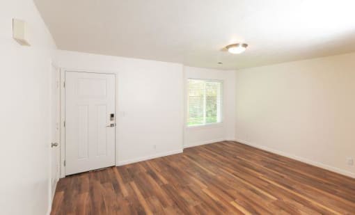 Woodgrain Floor Living Room at Devonshire Court Apartments & Townhomes, North Logan, Utah