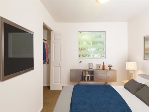 Spacious Bedroom With Comfortable Bed at Devonshire Court Apartments & Townhomes, North Logan, UT, 84341