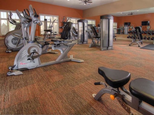 Fitness Center With Modern Equipment at Four Seasons Apartments & Townhomes, North Logan, UT, 84341