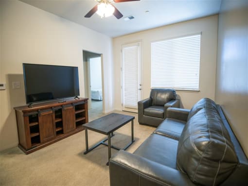 Light and Bright Living Area with Ceiling Fan at Four Seasons Apartments & Townhomes, North Logan, UT, 84341