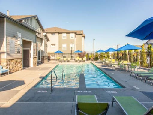 Swimming Pool Area With Shaded Chairs at Parc on Center Apartments & Townhomes, Orem, 84057