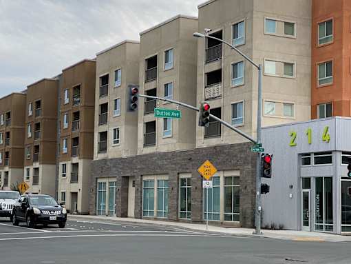 A street view of a building with a sign that says 214.