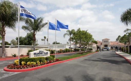 a building with flags and a road in front of it