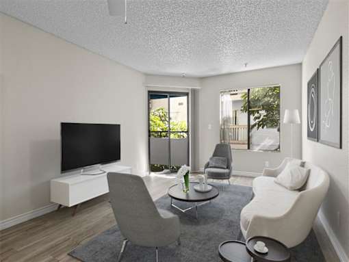 a living room with a couch and a tv at Harbor Terrace Apartments, California