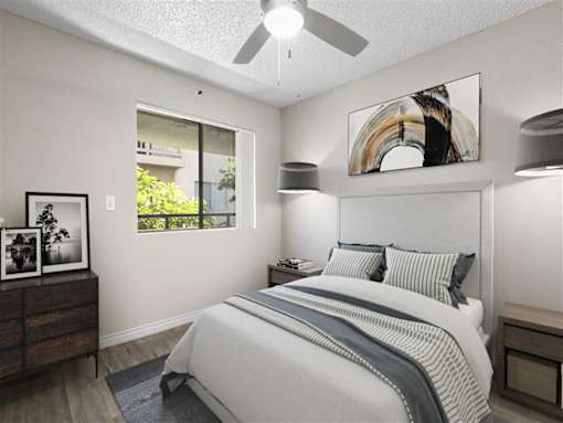 a bedroom with a bed and a ceiling fan at Harbor Terrace Apartments, San Pedro ,California, 90731