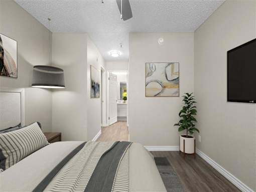 a bedroom with a bed and a tv at Harbor Terrace Apartments, San Pedro , CA 90731