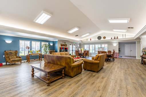 A living room with wooden floors and furniture.