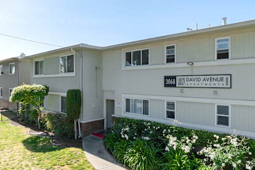 Apartment building with the number 3068 on the front.
