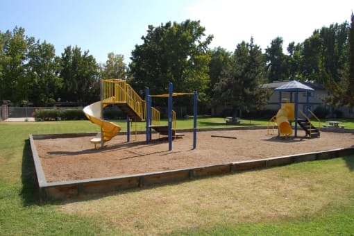 the playground is located on the side of the park
