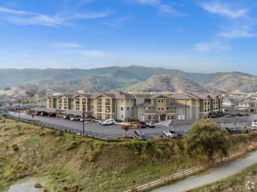 a view of a building with a mountain in the background