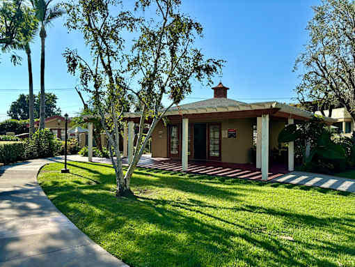 A house with a red and white striped front porch. at The Arbors Santa Ana, California, 92705