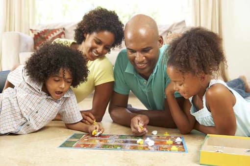  Four people playing a board game
