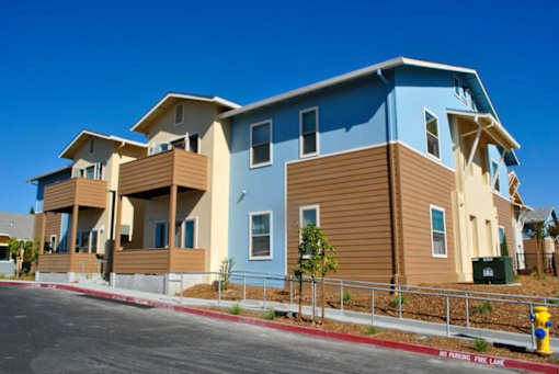 A row of houses with a fire lane in front.