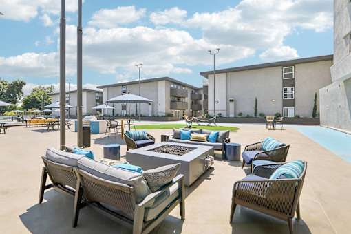 A sunny day at the outdoor seating area of a modern building.