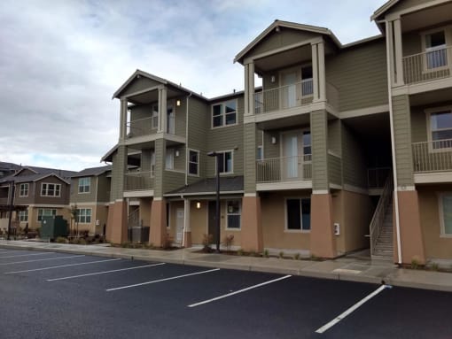 a row of apartment buildings on a street