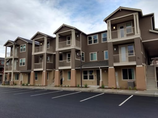 a row of apartment buildings on a street