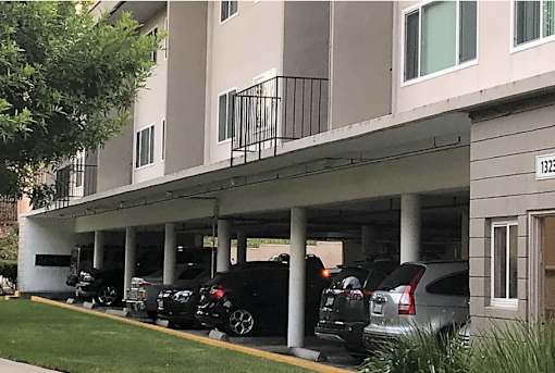 a group of cars parked in front of a building