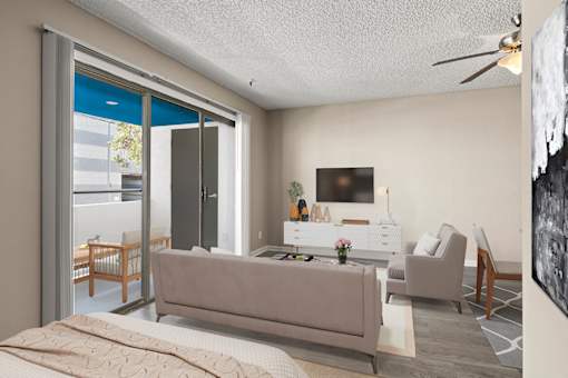 A modern living room with a grey sofa and a television in studio apartment at Harbor Terrace Apartments, California, 90731