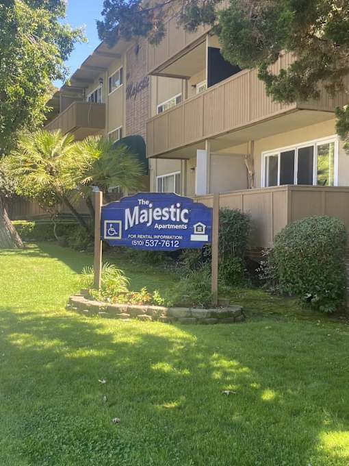the majestic apartments sign in front of the building